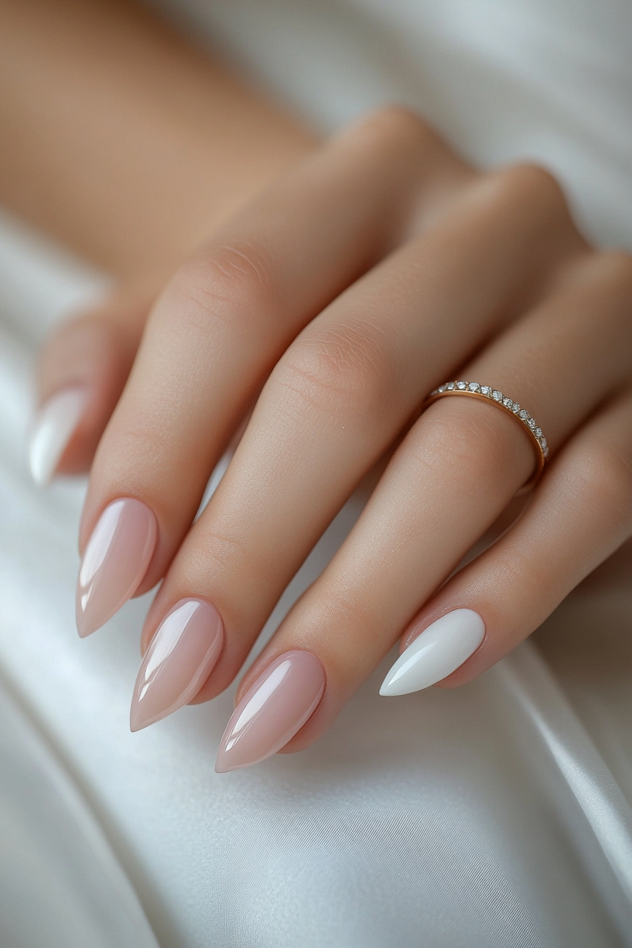 Colorful almond nails with geometric patterns on sandy background