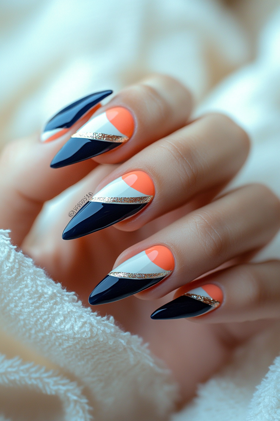 Nail design featuring nautical stripes in navy and white with an anchor charm